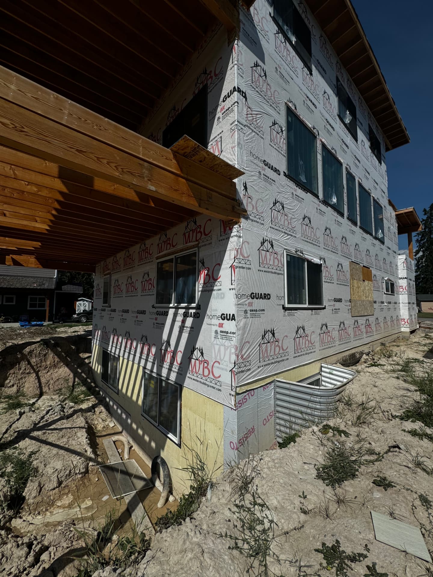 Wind-Exposed Elevation Rebuild — Stucco · Glacier corridor by DL Construction