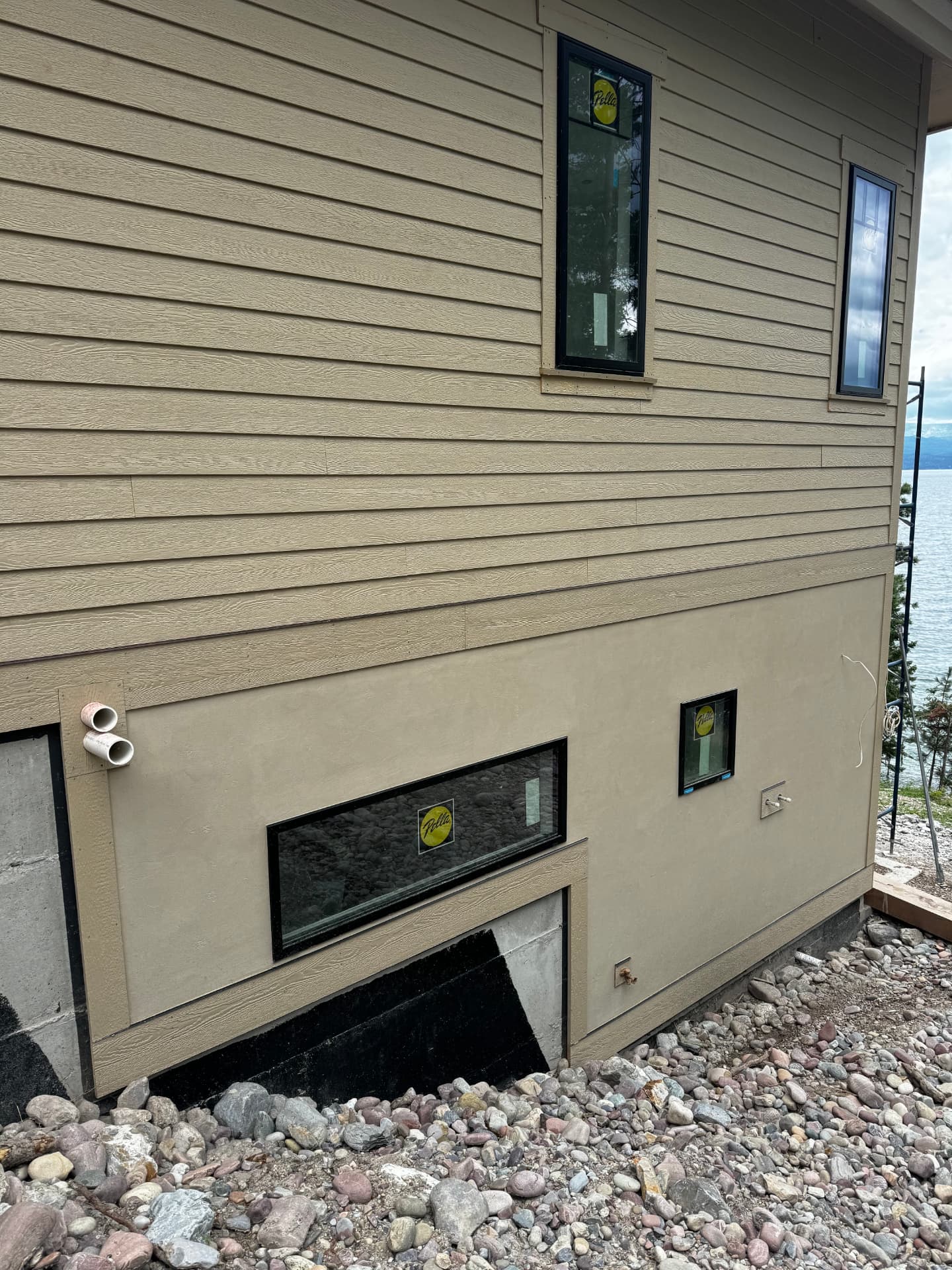 Finished stucco and stone exterior on a home in Lakeside, MT